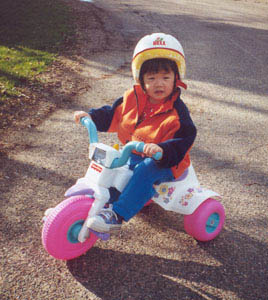 Maia Xing Riding Her Big Wheel